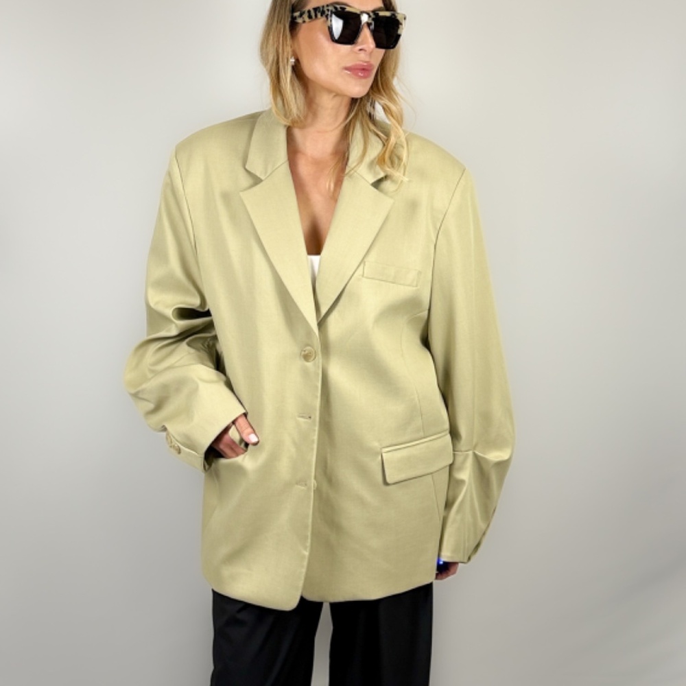 Sand color beige oversized blazer with wide sleeve. Woman blazer, suit jacket.